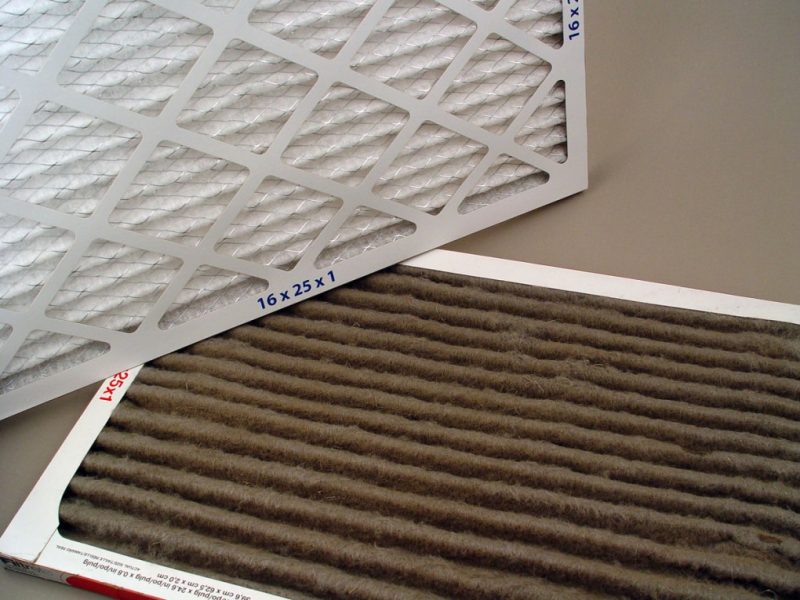 dirty and clean air filters, side by side