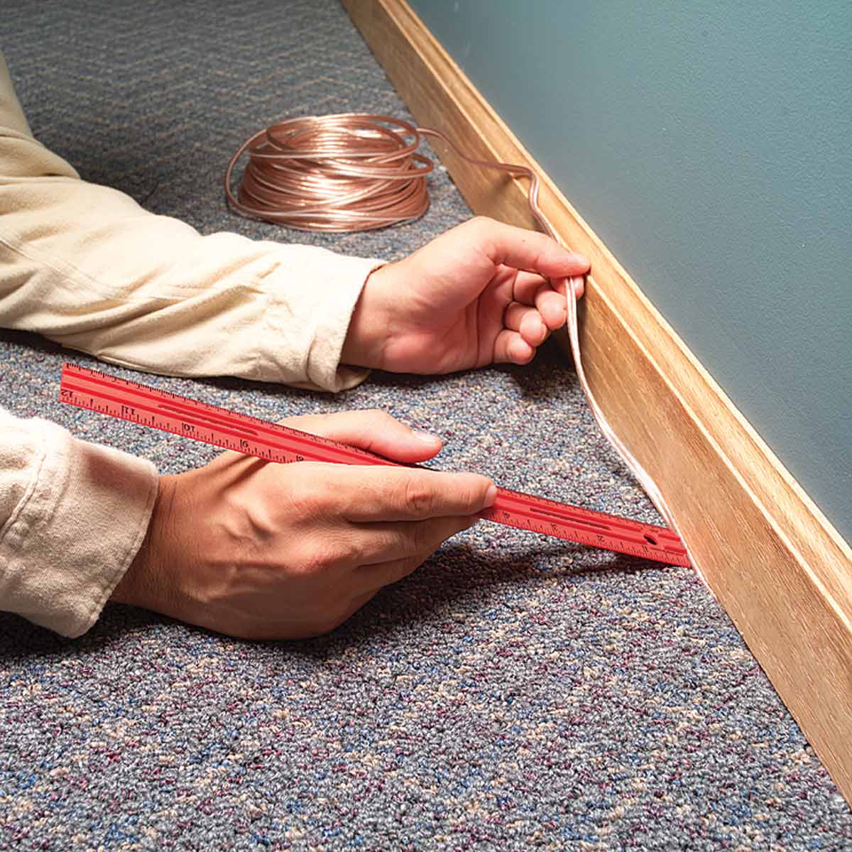 hide wires between carpet and baseboard