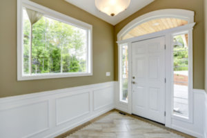 bold trim Paint colour in a modern hallway with dark wood door