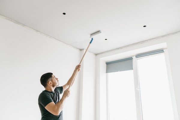 handyman painting a ceiling 