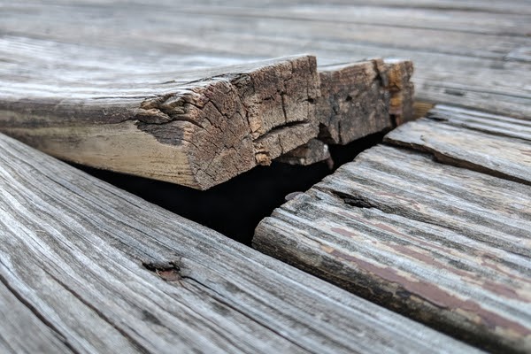 cracked and lifted deck board