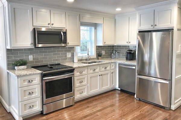white kitchen with cabinets refaced