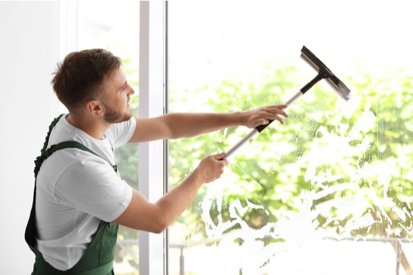 window cleaner cleaning window interior