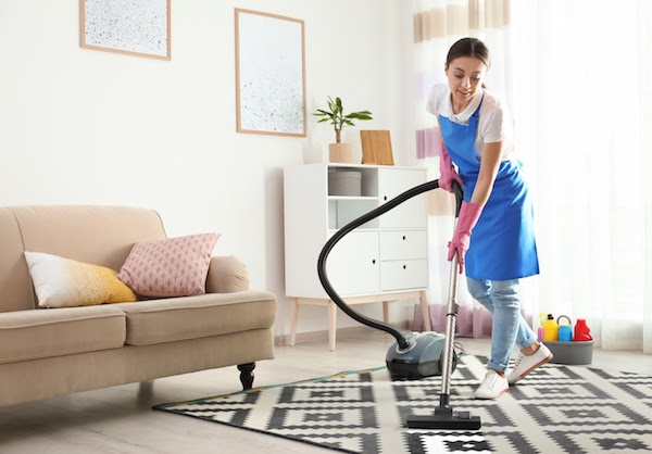 professional cleaning company cleaning a condo
