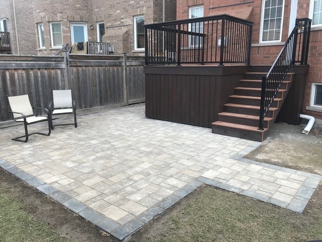backyard with stone patio and new deck