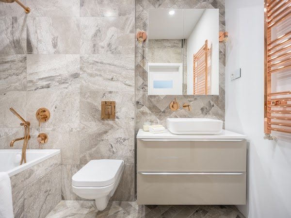 beautiful grey and copper bathroom renovation