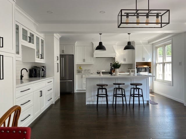 white kitchen with dark hardwood floors