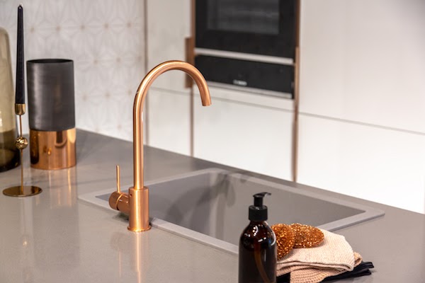beautiful copper faucet in kitchen