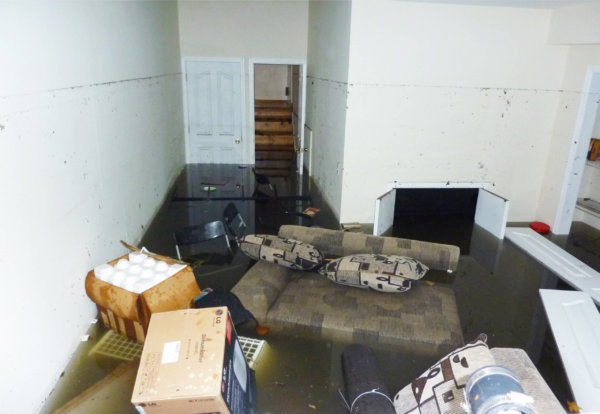 Furniture floating in flooded basement