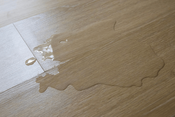 Water spilled on the laminate flooring.Damage the floor.