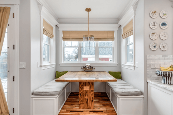 ELMHURST, IL, USA - JANUARY 30, 2020: A breakfast nook with bench seating and a hardwood table built into the house.