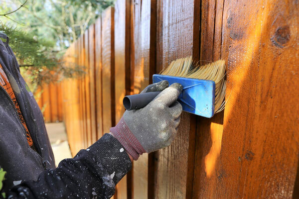 Painting a wooden garden fence