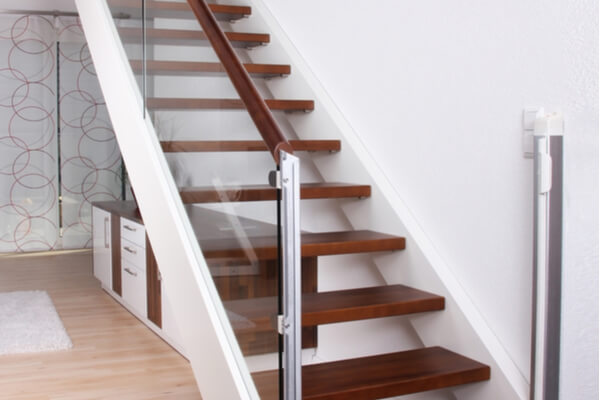wooden straight staircase glass railing