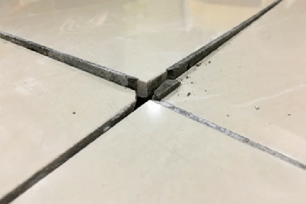tile lifting from floor