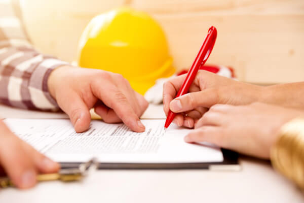 homeowner signing contract for bathroom upgrade