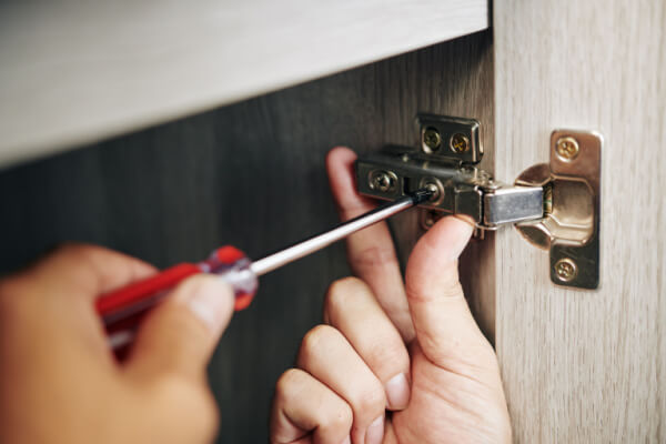 repairing hinge on cabinet door