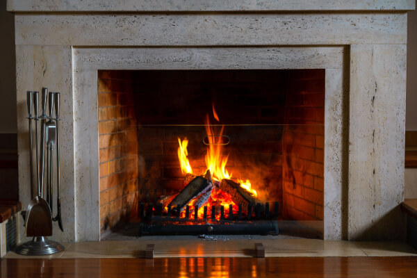 wood burning fireplace lit cozy
